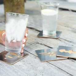 ShopHippo New DC Comics Superhero Logo 4-Piece Coaster Set | Batman, Superman, Wonder Woman & The Flash Laser-Cut Justice League Logos - Sturdy, Unique Cork & Ceramic Design - Great Gift Idea